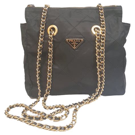 black and gold prada bag|black prada handbag.